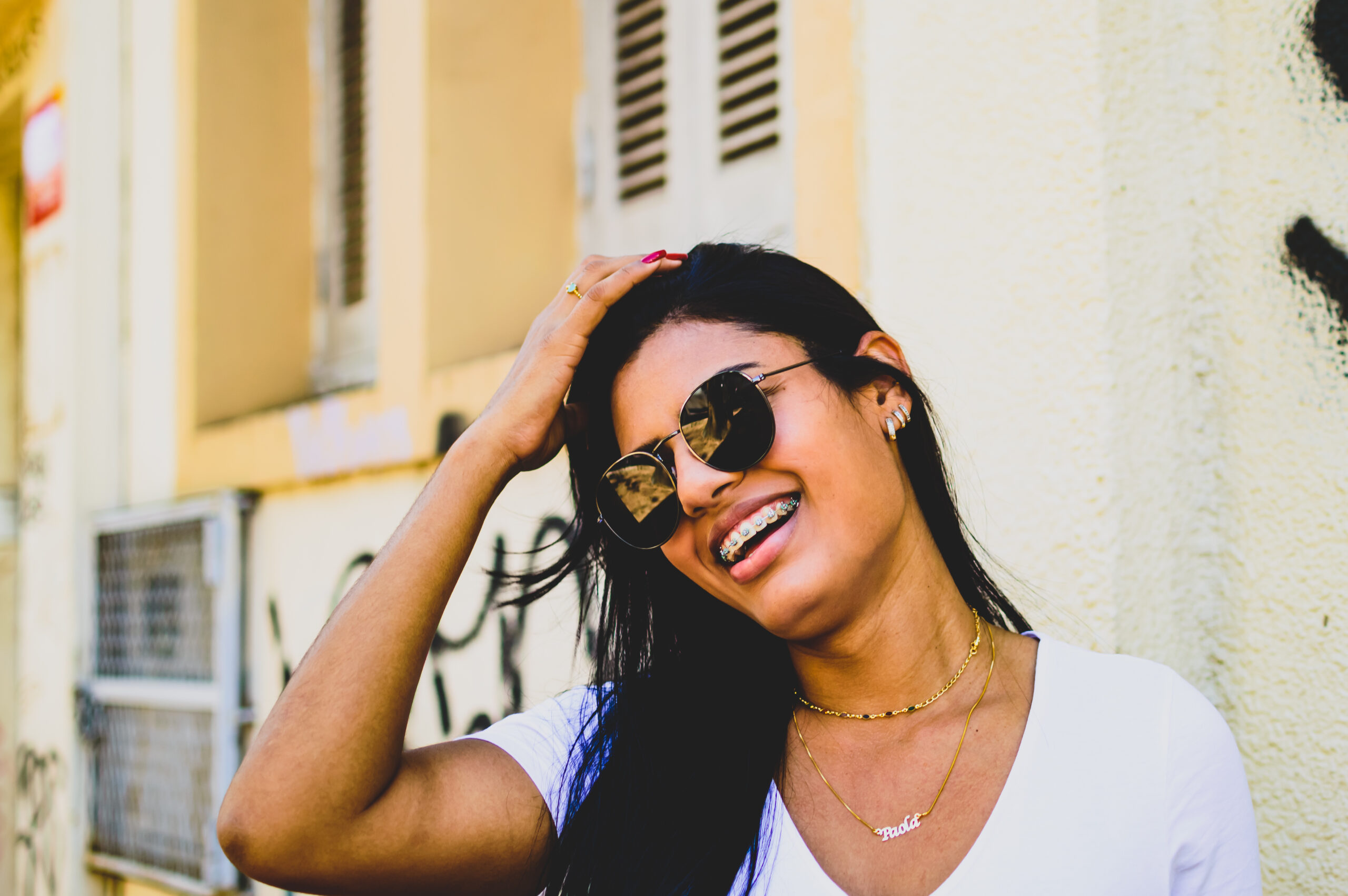Young woman with clear braces smiling