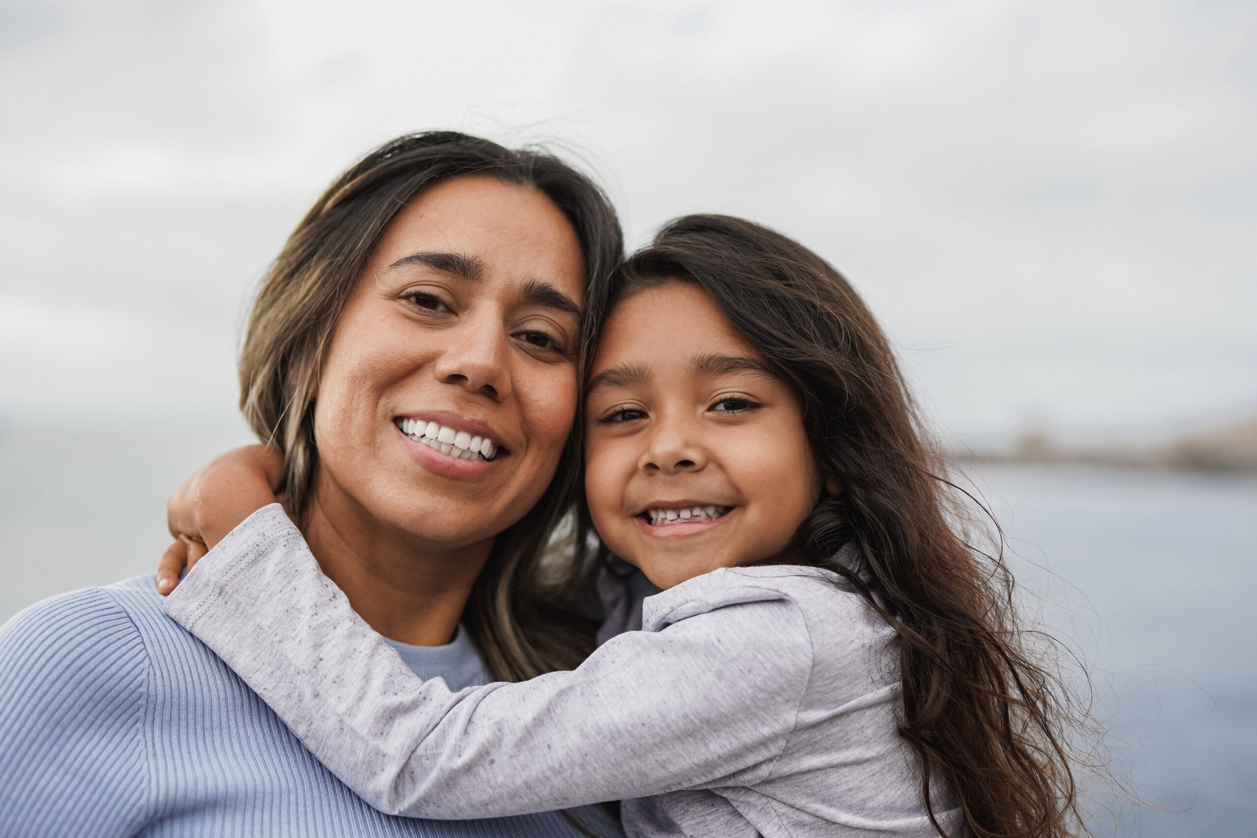 Parent and child smiling together